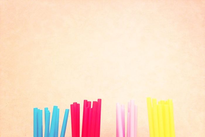COLORFUL PENCILS ON WHITE BACKGROUND