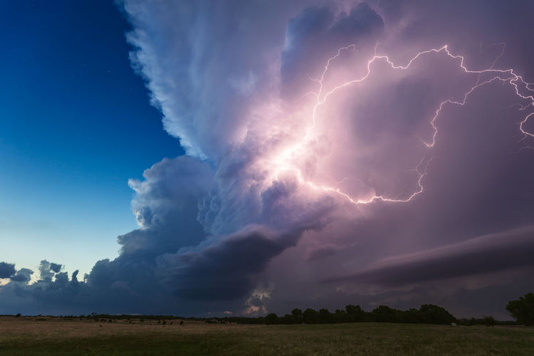 Thunderstorm cumulonimbus cloud illuminated by lightning