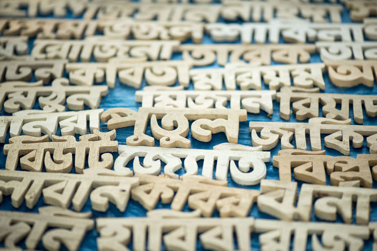 Close-up of wooden text on table