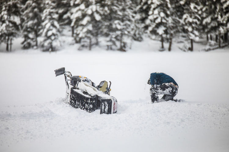 Snowmobiler crashes his sled during failed high-speed stunt