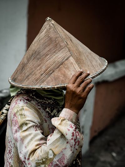 Close-up of woman wearing asian style conical hat
