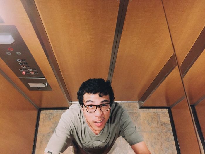 High angle view of man in elevator