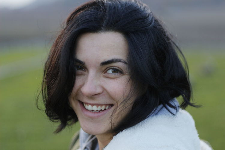 Portrait of smiling woman on field