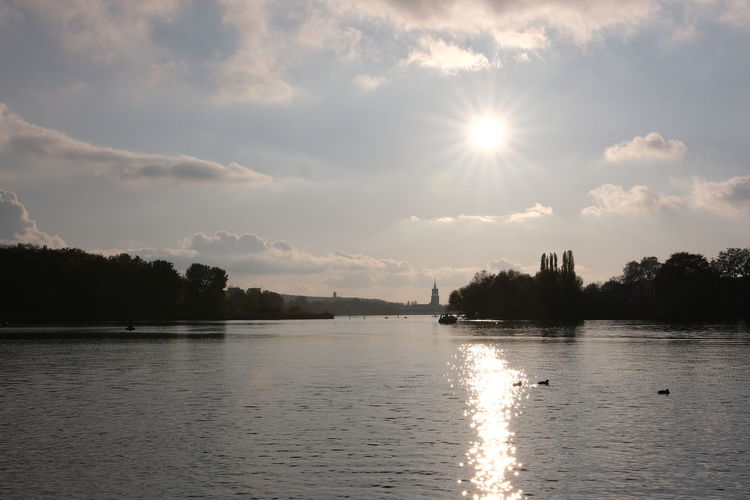 Scenic view of lake against sky during sunset