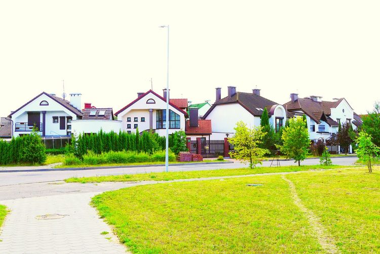 View of lawn with buildings in background