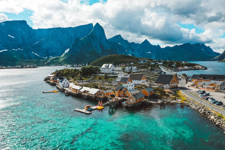 Aerial view of a fishing village with yellow cabins in lofoten norway