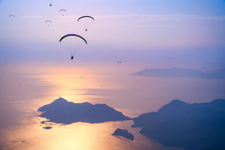 Extreme sport paragliding at sunset
