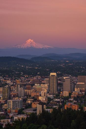 Cityscape against sky during sunset