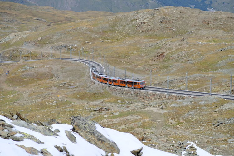 High angle view of railroad tracks by mountain