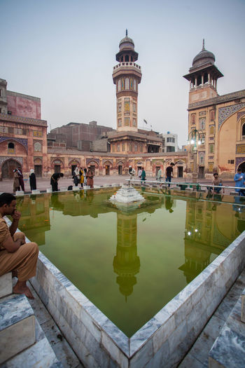 Reflection of historical wazir khan mosque in water. 