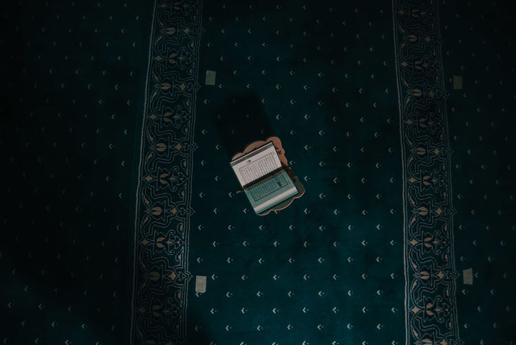 High angle view of telephone on table against wall