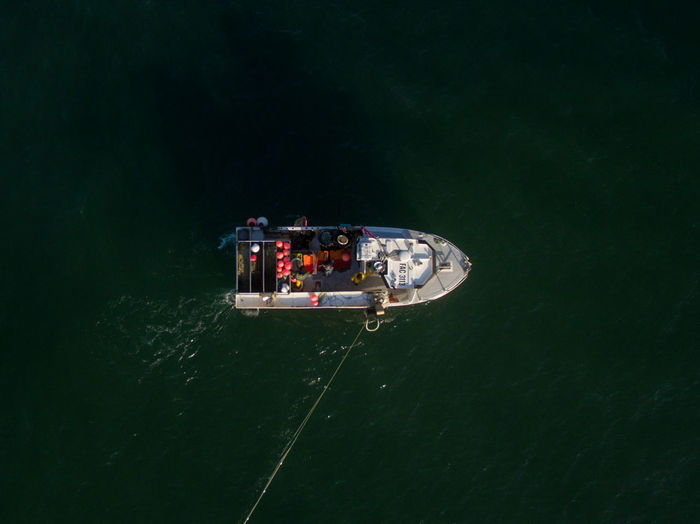 High angle view of ship sailing in sea