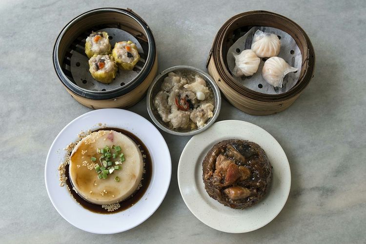 High angle view of various chinese dishes on marble