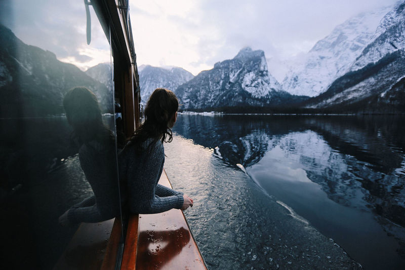 Girl on boat on the Königssee in Bayern, Germany with mountain backdrop Reflection Water Nature Real People Girl Germany Outdoors Boat Tranquility Lake Woman Mountain Bayern Alps Scenics Beauty In Nature Königssee Lifestyles Bayern Germany One Person Tranquil Scene Mountain Range Leisure Activity EyeEmNewHere Sky Day Rear View Cloud - Sky Vacations Women Young Adult People