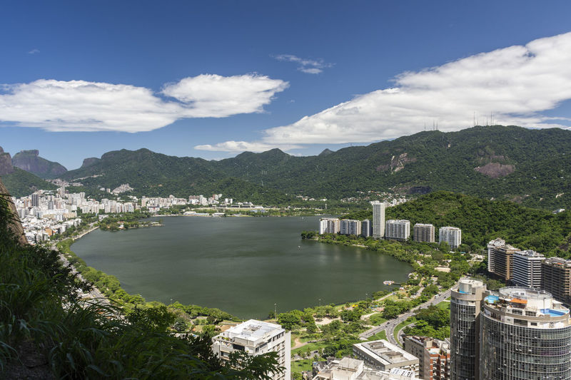 View to residential buildings in lagoa and green forested mountains