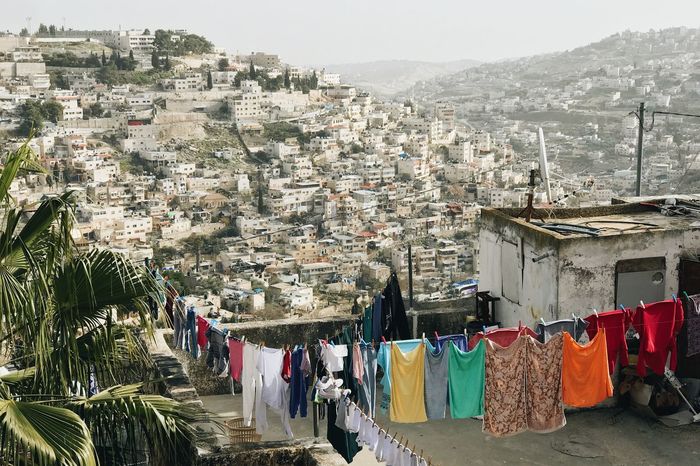 High angle view of clothes drying on building terrace in city