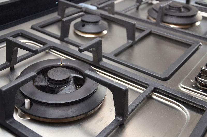 Close-up of gas stove burner in kitchen