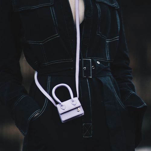 Midsection of woman wearing coat