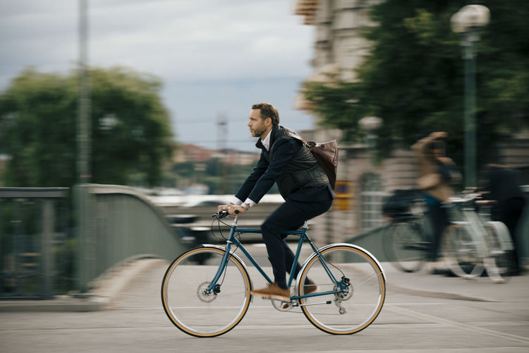 Man riding bicycle on city