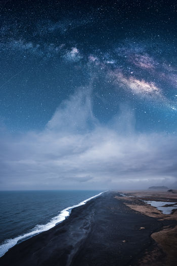 Ethereal view of a beach and milky way