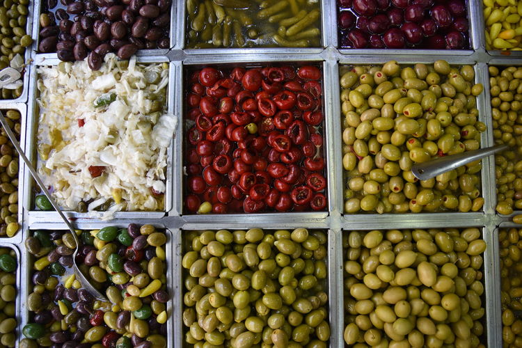 Close-up of pickles and colored olives. levinsky market, tel aviv