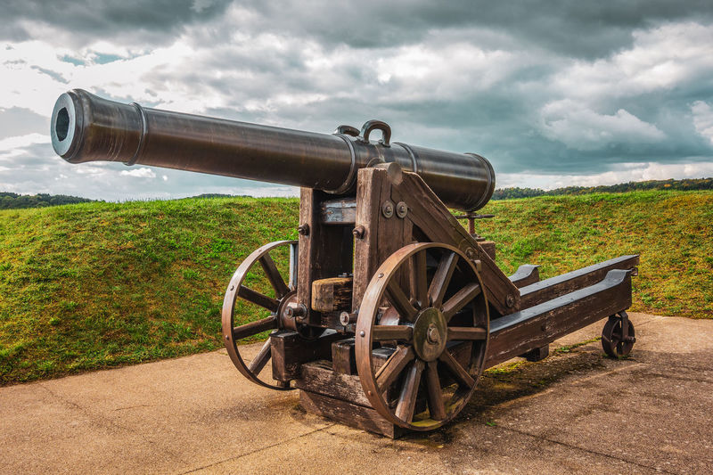 Old historical cannon, storm clouds in the background