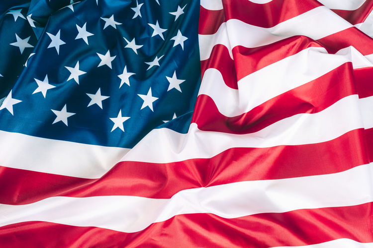 Close-up of flag against blue sky