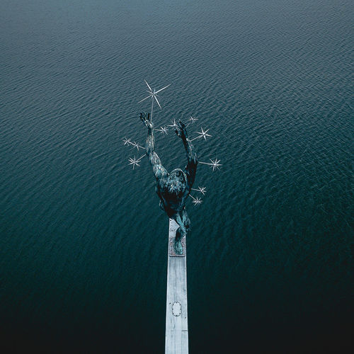 High angle view of statue against sea