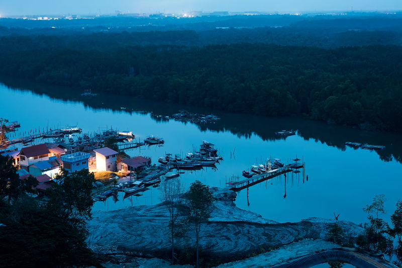Aerial view during blue hour, a typical fisherman village in lumut, perak, malaysia.