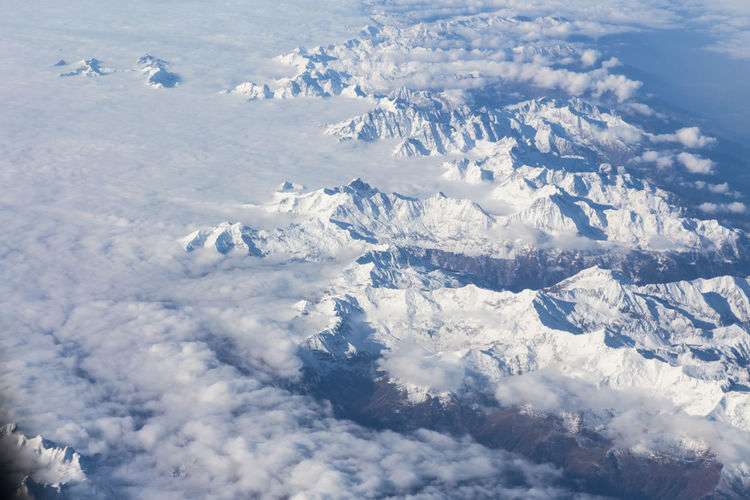 High angle view of snowcapped mountain against sky