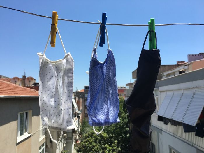 Clothes drying on clothesline against buildings