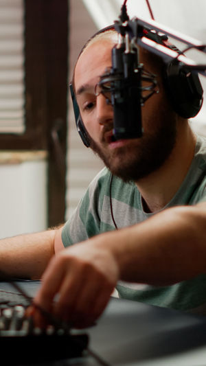 Man singing song at recording studio