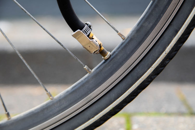Inflate flat tire of bike by tube with through car valve