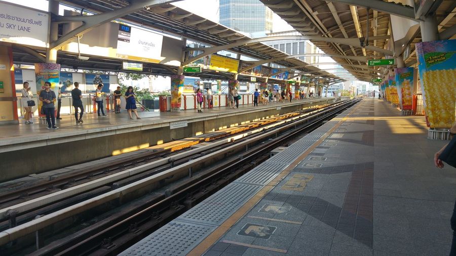 People at railroad station platform
