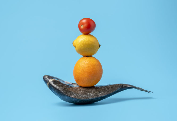 Close-up of oranges against blue background