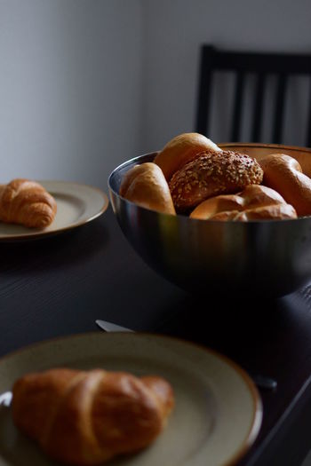 High angle view of breads and croissants on table
