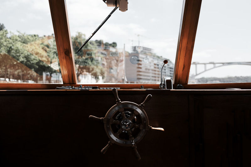 Close-up of steering wheel in sailboat