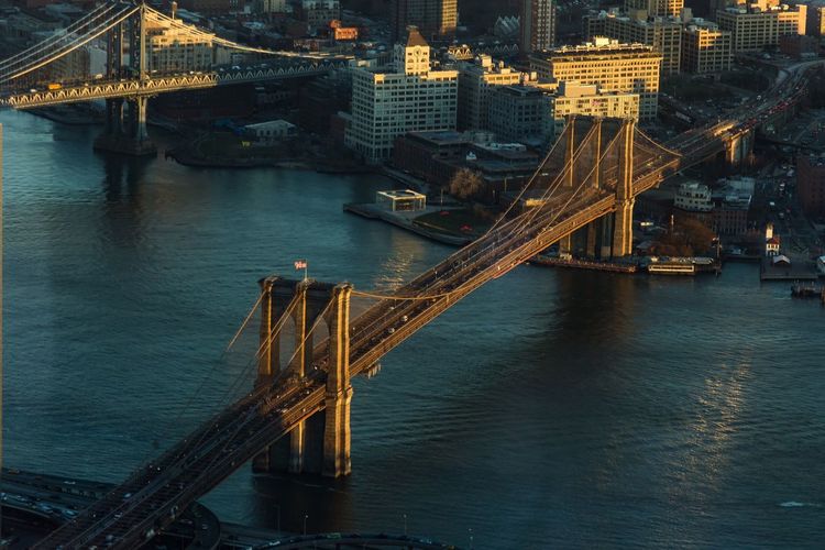 High angle view of bridges over east river at sunset