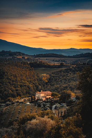 High angle view of townscape against orange sky