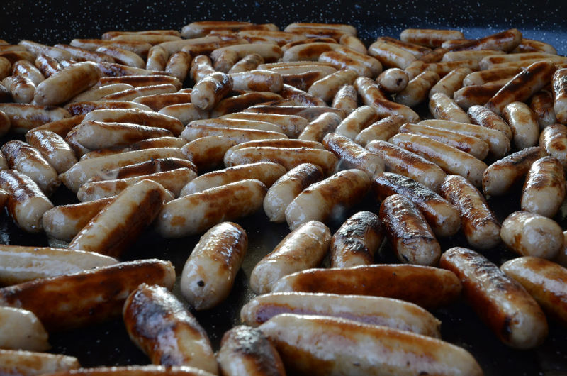 Close-up of large number of cooked sausages