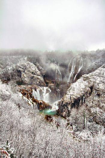 Aerial view of snow covered waterfall