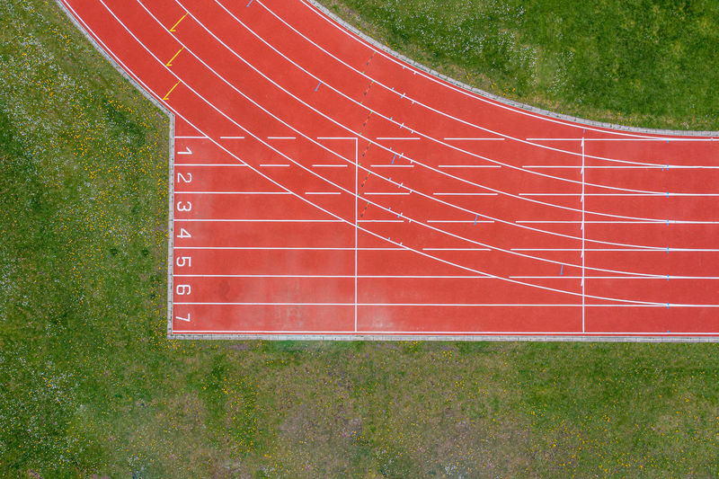 High angle view of red umbrella on land