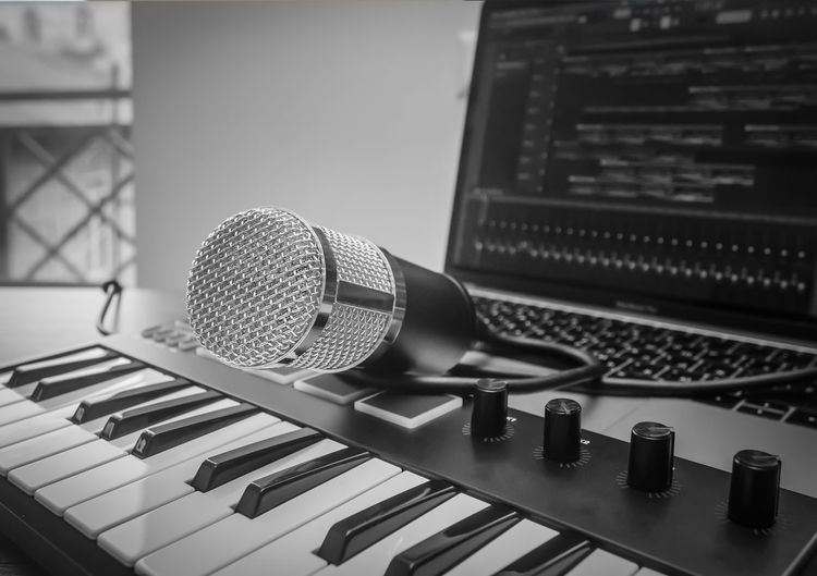 Home music studio microphone, midi keyboard, laptop