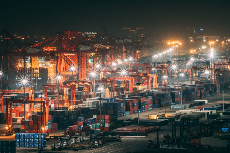 Cargo containers at commercial dock at night