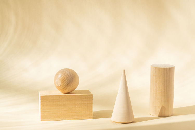 Stands for product of wooden natural shapes. cube, ball and cone as podiums. creative composition 