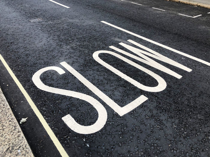 High angle view of arrow sign on road