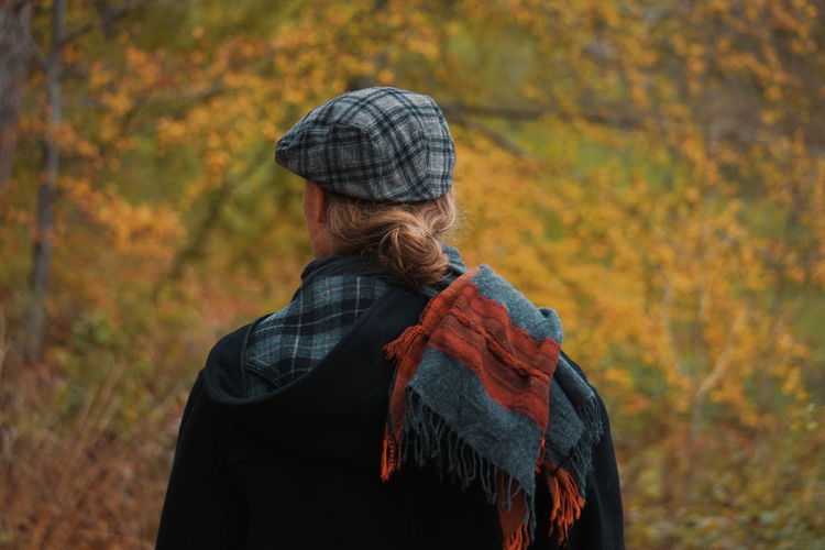 Rear view of man wearing warm clothing during autumn