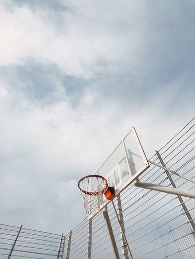 Low angle view of basketball hoop against sky