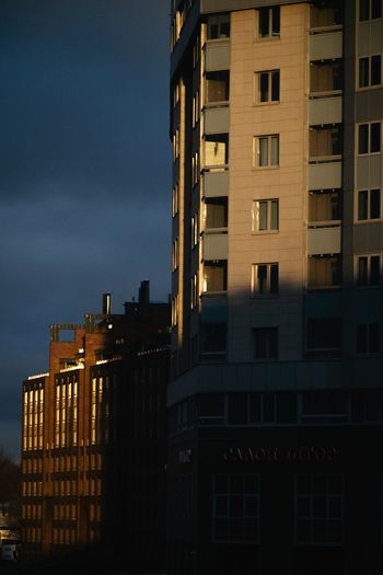 Buildings against sky at dusk