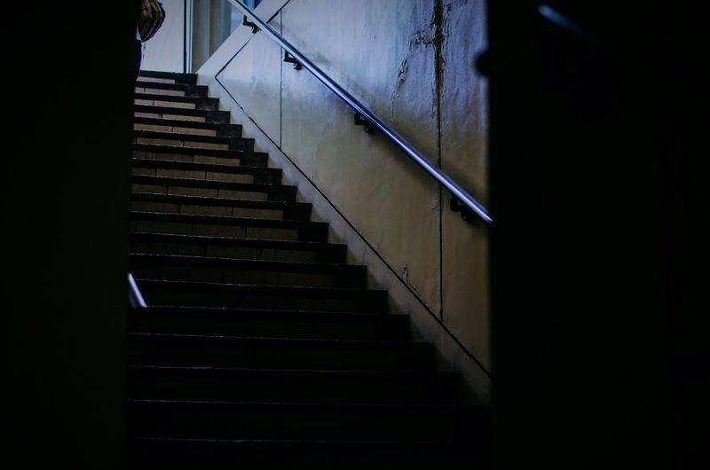 Low angle view of stairs against wall